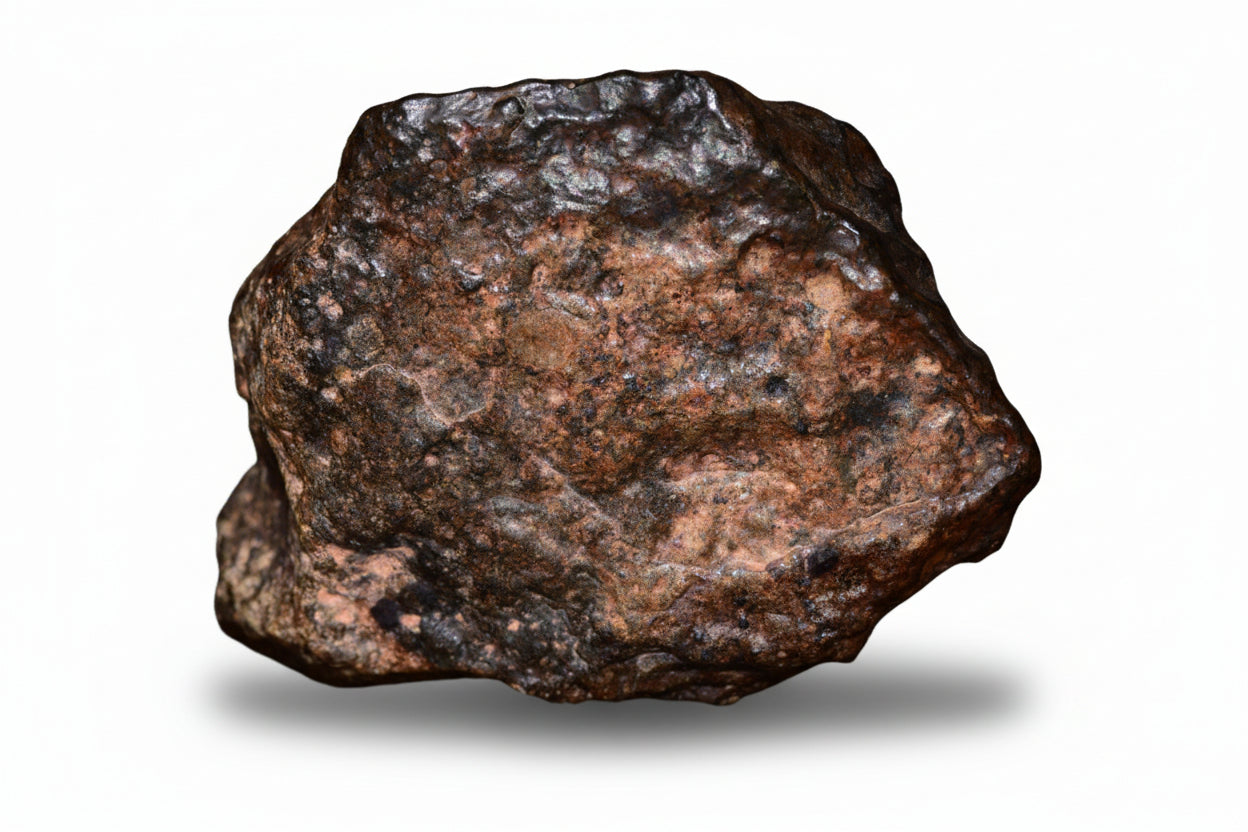 Natural fragment of NWA 13272 ungrouped achondrite meteorite, 10.7g, showing rugged surface and metallic details.
